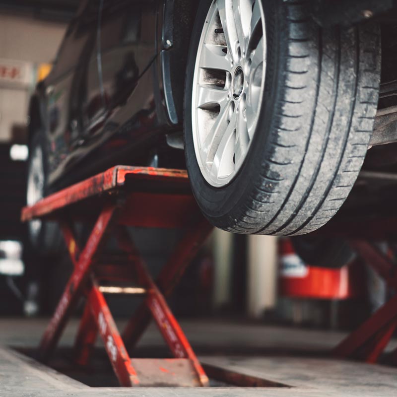 car lifted in auto shop